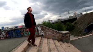 handsome guy masturbates his big dick on the embankment in extreme