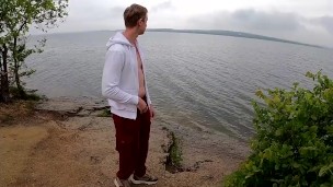 the guy jerks off his big beautiful dick by the lake