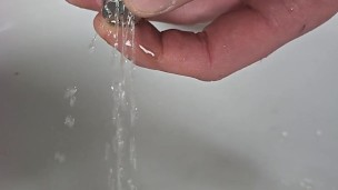 Urethral Sounding with a sprinkler end , pissing through it