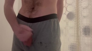 Huge cumshot, piss and shower in grey boxers