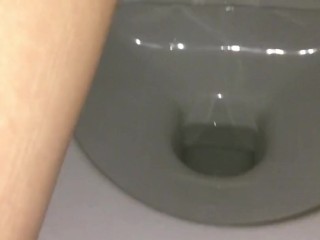 Girl pissing in public toilet with tampon inside. Very hairy pussy