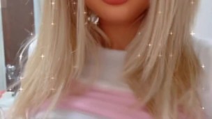Blonde Barbie Doll plays with her big boobs
