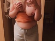 Cute blonde girl plays with her big boobs