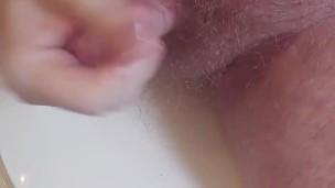 Bathroom masturbating with a side view