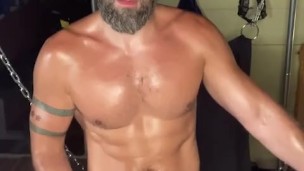 Bearded jock strokes his dick