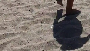 Sexy girl walking naked on the beach - she loves showing off