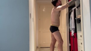 Businessman farting while he put on his suit