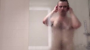 HAIRY OTTER JERKS OFF IN A HOTEL SHOWER