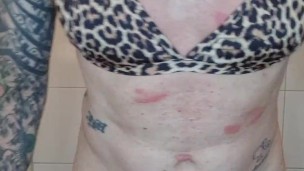 Sissy in leopard bikini fucks dildo
