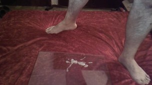 I jerk off, have a big load and play with the cum with my feet.