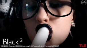 Long legs spread wide as she masturbates with a vibrating wand