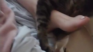 Girl just with kittens all around her