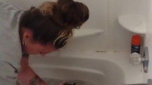 Pretty girl gives kitten a bath