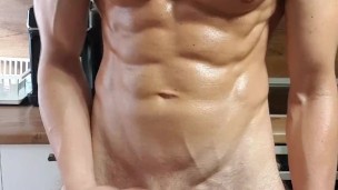 Tall fit dom flexes his oiled body and masturbates