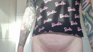 Sissy shows buttplug and pisses from her cage