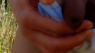 Hot twink in wet white briefs sticks out uncut foreskin dick to piss pee outdoors on summer beach
