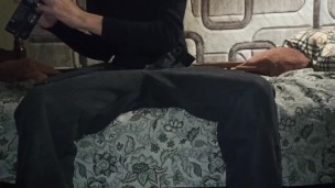 a skinny boy in a turtleneck cums in a condom