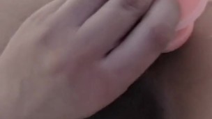Sexy Asian jerks with all her might while masturbating