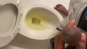 Young black dude pulls down underwear and pisses