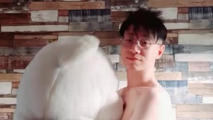 NAKE BOY DANCES WITH A BEAR