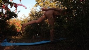 Asian twink does naked yoga in a naturist pink orchard on the last hot days of the nudist year