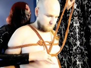 Halloween is coming! Bondage and whipping of slave. Dominatrix in a scary mask. 7/16