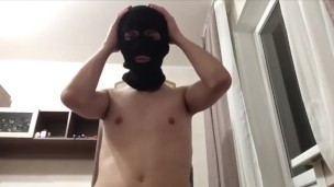 In a mask plays with his dick through his panties