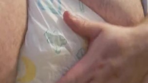chubby bear rubbing his very wet diaper