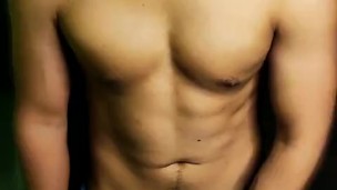 athletic boy stroking his cock