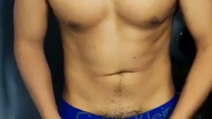 Stroking his cock in underwear