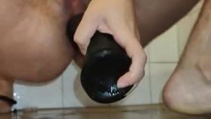 ftm desperately fucks his sloppy asshole until his thighs tremble