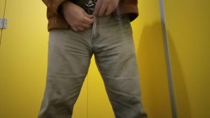 Peeing in a public toilet.