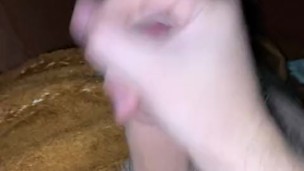 a young guy jerks off his big wet cock.