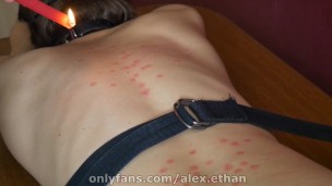 Tied up teen lad treated with hot wax and spanking