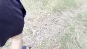 A man pisses and plays with his dick in the forest