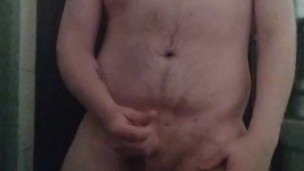 Guy jerks off in the shower and is real vocal about it