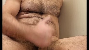 Hairy muscle bear stroking cock and cumming!
