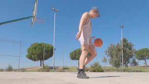 Sweaty basketball in tight singlet on public field