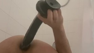 In A Chastity cage playing with toys