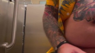 Bearded Tattooed Daddy jerks off in public restroom