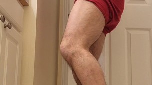 Hairy muscle bear flexing in red boxer briefs
