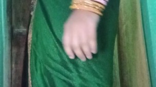 Indian gay Crossdresser Gaurisissy in Green Saree pressing her big Boobs and fingering in her ass