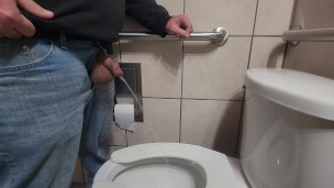 Pissing with huge balls hanging