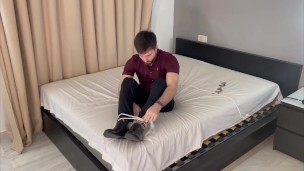Suited boss self bondage gone wrong