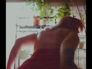Seductive house wife in window