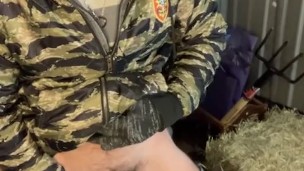 Bearded farmer pisses in barn