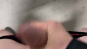 Twink jerks off in parking garage and blows load
