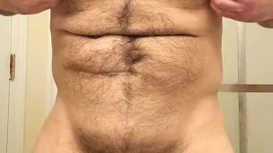 HAIRY MUSCLE BEAR PLAYING WITH NIPPLES AND STROKING COCK