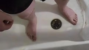 Playing with my piss while wearing underwear.