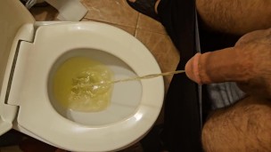 Shaved cock pissing